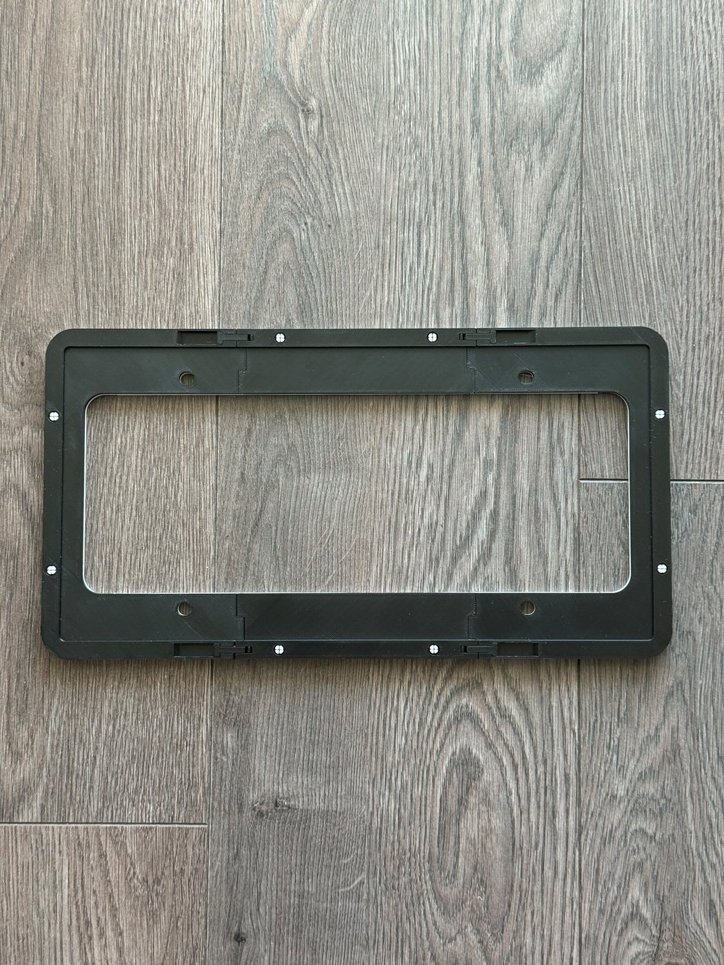 Back of the frame showing the mounting face and bolt holes